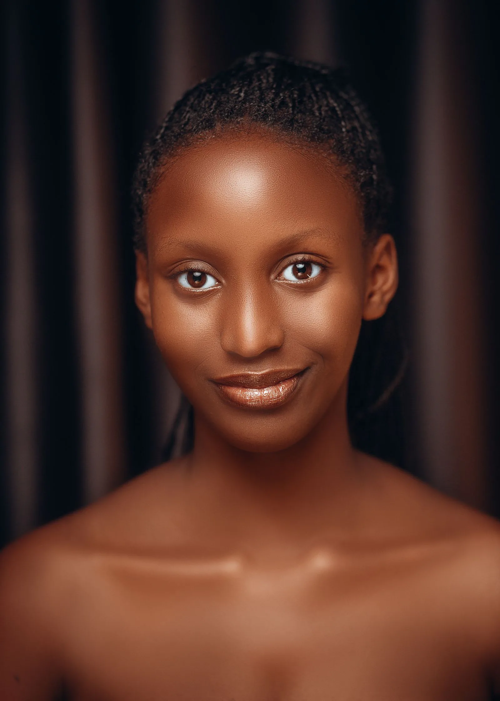 A woman with radiant, healthy, deeper-toned skin